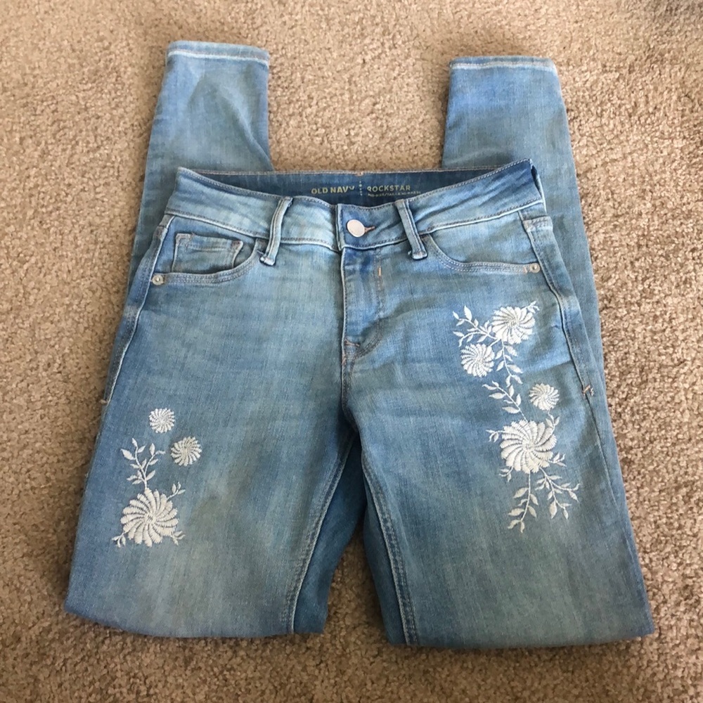 Light blue ripped skinny with flower pattern